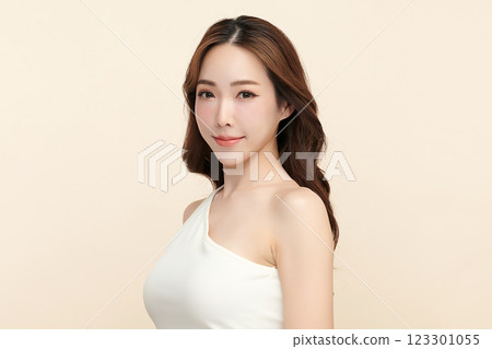 Beautiful young asian woman with clean fresh skin on beige background, Face care, Facial treatment, Cosmetology, beauty and spa, Asian women portrait. Beautiful young asian woman with clean fresh skin on beige background, Face care, Facial treatment, Cosmetology, beauty and spa, Asian women portrait. 123301055