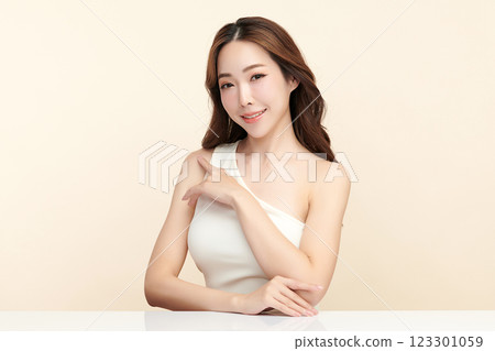 Beautiful young asian woman with clean fresh skin on beige background, Face care, Facial treatment, Cosmetology, beauty and spa, Asian women portrait. Beautiful young asian woman with clean fresh skin on beige background, Face care, Facial treatment, Cosmetology, beauty and spa, Asian women portrait. 123301059