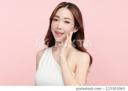Beautiful young asian woman with clean fresh skin on pink background, Face care, Facial treatment, Cosmetology, beauty and spa, Asian women portrait. Beautiful young asian woman with clean fresh skin on pink background, Face care, Facial treatment, Cosmetology, beauty and spa, Asian women portrait. 123301063