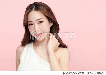 Beautiful young asian woman with clean fresh skin on pink background, Face care, Facial treatment, Cosmetology, beauty and spa, Asian women portrait. Beautiful young asian woman with clean fresh skin on pink background, Face care, Facial treatment, Cosmetology, beauty and spa, Asian women portrait. 123301064