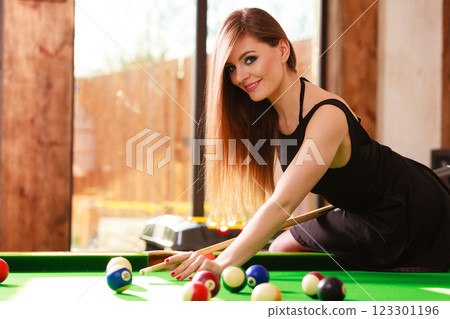 Young woman having fun with billiard. Young woman having fun with billiard. 123301196