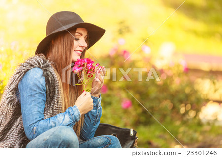 Young lady relaxing in garden 123301246