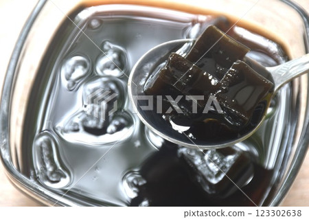 black grass jelly Chinese cold sweetmeat in syrub in glass bowl black grass jelly Chinese cold sweetmeat in syrub in glass bowl 123302638
