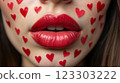 Close-up of beautiful aesthetic lips with red lipstick filled with decorative hearts around, sexy and sensual atmosphere 123303222