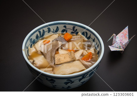 Enjoy warm Himokawa Udon noodles stewed with root vegetables during the cold winter. Enjoy warm Himokawa Udon noodles stewed with root vegetables during the cold winter. 123303601