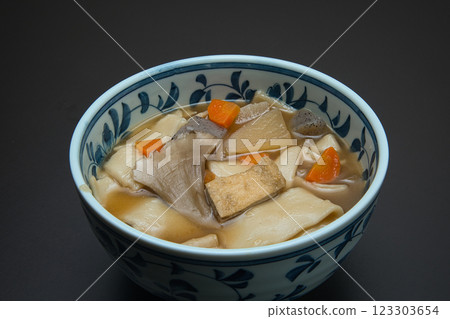 Enjoy warm Himokawa Udon noodles stewed with root vegetables during the cold winter. Enjoy warm Himokawa Udon noodles stewed with root vegetables during the cold winter. 123303654