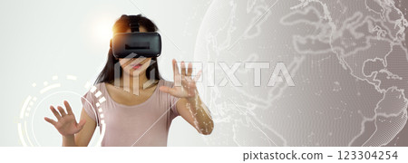 Woman wearing VR glasses and accessing the technologyinternet, multimedia, storage network connection conceptand a large database big data through internet technology. E-learning, online study. Woman wearing VR glasses and accessing the technologyinternet, multimedia, storage network connection conceptand a large database big data through internet technology. E-learning, online study. 123304254