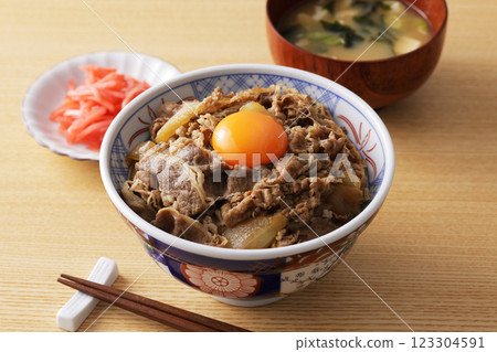 A delicious-looking beef bowl topped with egg yolk A delicious-looking beef bowl topped with egg yolk 123304591