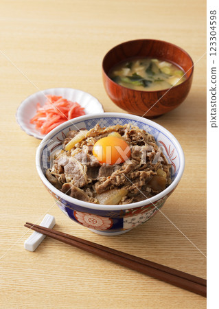 A delicious-looking beef bowl topped with egg yolk 123304598