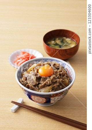 A delicious-looking beef bowl topped with egg yolk A delicious-looking beef bowl topped with egg yolk 123304600