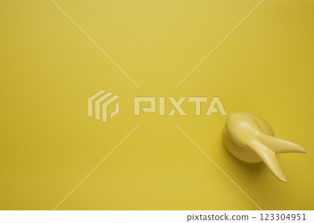 Yellow empty background with easter bunny Yellow empty background with easter bunny 123304951