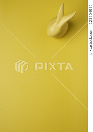 Yellow empty background with easter bunny 123304953