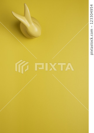 Yellow empty background with easter bunny 123304954