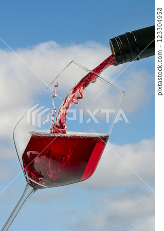 Pouring red wine Pouring red wine 123304958