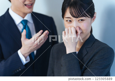 Female business person who is concerned about bad breath 123305889