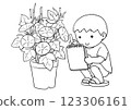 一個男孩蹲下來觀察牽牛花 123306161