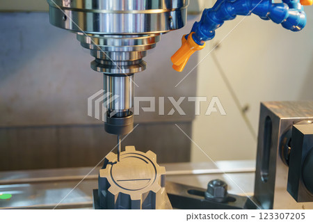The CNC milling machine cutting the graphite electrode parts. 123307205