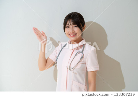 Female staff member giving guidance Female staff member giving guidance 123307239