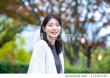 A young woman smiling at the park 123307247