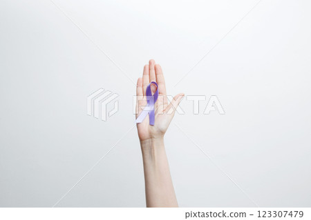 Purple Epilepsy Awareness Day, purple ribbon held, symbol of support 123307479