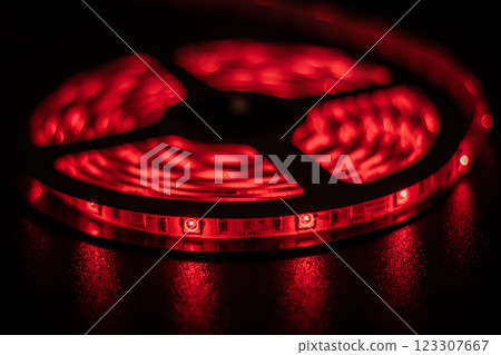 Illuminated Red LED Light Strip on a Dark Surface Illuminated Red LED Light Strip on a Dark Surface 123307667