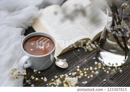 Spring background with cup of hot chocolate cacao Spring background with cup of hot chocolate cacao 123307815