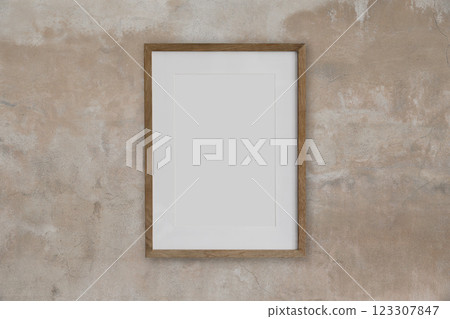 One empty vertical wooden picture frame mockup on beige textured concrete shabby wall. Blank poster template in room. Wooden photo frame mock up, empty print background. Gallery design One empty vertical wooden picture frame mockup on beige textured concrete shabby wall. Blank poster template in room. Wooden photo frame mock up, empty print background. Gallery design 123307847