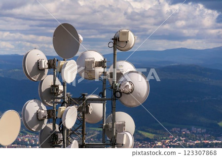 Bunch of transmitters and aerials on telecommunication tower 123307868