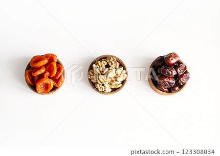 Organic Dates, Walnuts and Apricots a Perfect Trio for Healthy Snacking and Gourmet Recipes. Organic Dates, Walnuts and Apricots a Perfect Trio for Healthy Snacking and Gourmet Recipes. 123308034