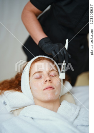 Relaxing facial treatment for skin rejuvenation at a spa Relaxing facial treatment for skin rejuvenation at a spa 123308627