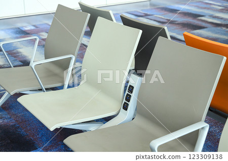 passenger seats in Departure lounge with charging points at the modern airport. passenger seats in Departure lounge with charging points at the modern airport. 123309138