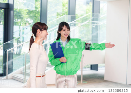 Event staff guiding customers with a smile 123309215