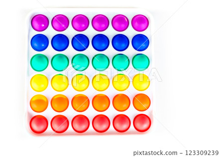 Sensory anti stress toy Pop it Fidget Toy Colorful, on white background. Copy space 123309239