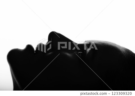 Part beautiful woman face silhouette covered in shadow Part beautiful woman face silhouette covered in shadow 123309320