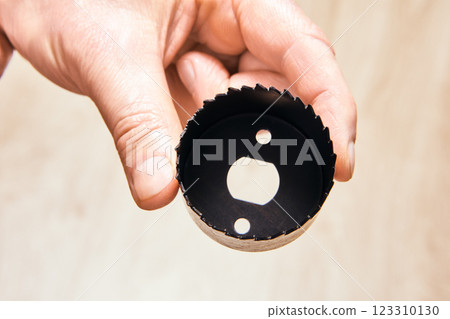 Lock installation hole saw with sharp saw blades, designed for cutting precise holes in doors for deadbolt and door lock installations. 123310130