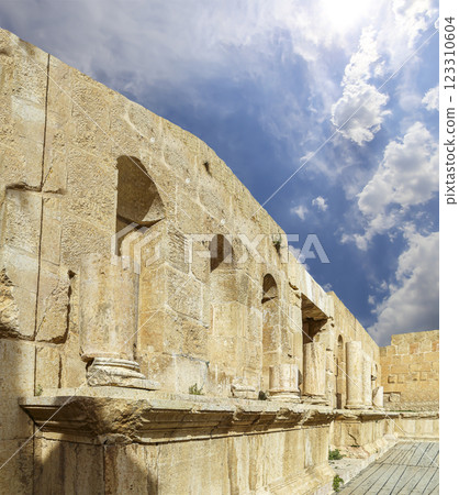 Roman ruins (against the background of a beautiful sky with clouds) in the Jordanian city of Jerash (Gerasa of Antiquity), capital and largest city of Jerash Governorate, Jordan Roman ruins (against the background of a beautiful sky with clouds) in the Jordanian city of Jerash (Gerasa of Antiquity), capital and largest city of Jerash Governorate, Jordan 123310604