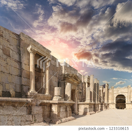 Roman ruins (against the background of a beautiful sky with clouds) in the Jordanian city of Jerash (Gerasa of Antiquity), capital and largest city of Jerash Governorate, Jordan Roman ruins (against the background of a beautiful sky with clouds) in the Jordanian city of Jerash (Gerasa of Antiquity), capital and largest city of Jerash Governorate, Jordan 123310615