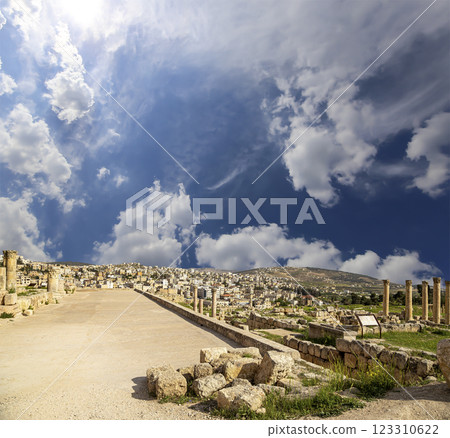 Roman ruins (against the background of a beautiful sky with clouds) in the Jordanian city of Jerash (Gerasa of Antiquity), capital and largest city of Jerash Governorate, Jordan 123310622