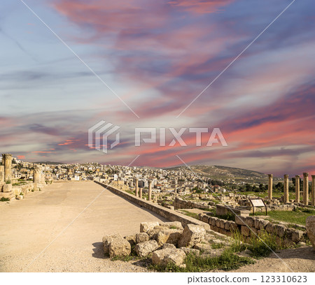 Roman ruins (against the background of a beautiful sky with clouds) in the Jordanian city of Jerash (Gerasa of Antiquity), capital and largest city of Jerash Governorate, Jordan Roman ruins (against the background of a beautiful sky with clouds) in the Jordanian city of Jerash (Gerasa of Antiquity), capital and largest city of Jerash Governorate, Jordan 123310623