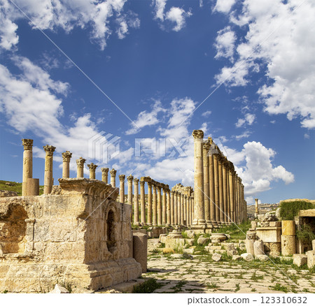 Roman ruins (against the background of a beautiful sky with clouds) in the Jordanian city of Jerash (Gerasa of Antiquity), capital and largest city of Jerash Governorate, Jordan Roman ruins (against the background of a beautiful sky with clouds) in the Jordanian city of Jerash (Gerasa of Antiquity), capital and largest city of Jerash Governorate, Jordan 123310632