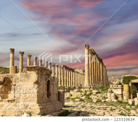 Roman ruins (against the background of a beautiful sky with clouds) in the Jordanian city of Jerash (Gerasa of Antiquity), capital and largest city of Jerash Governorate, Jordan Roman ruins (against the background of a beautiful sky with clouds) in the Jordanian city of Jerash (Gerasa of Antiquity), capital and largest city of Jerash Governorate, Jordan 123310634