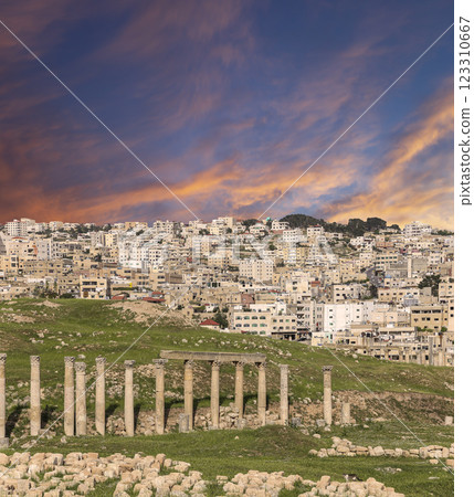 Roman ruins (against the background of a beautiful sky with clouds) in the Jordanian city of Jerash (Gerasa of Antiquity), capital and largest city of Jerash Governorate, Jordan 123310667