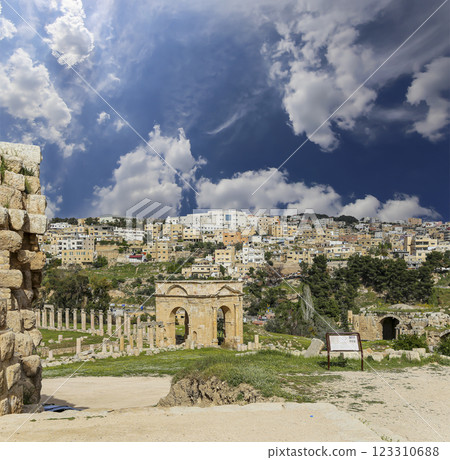 Roman ruins (against the background of a beautiful sky with clouds) in the Jordanian city of Jerash (Gerasa of Antiquity), capital and largest city of Jerash Governorate, Jordan 123310688