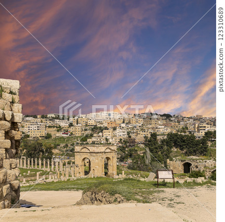Roman ruins (against the background of a beautiful sky with clouds) in the Jordanian city of Jerash (Gerasa of Antiquity), capital and largest city of Jerash Governorate, Jordan 123310689
