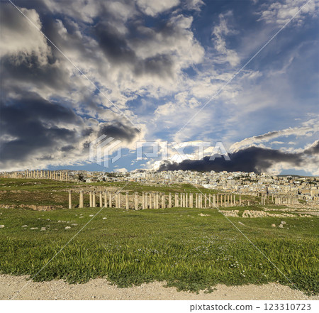 Roman ruins (against the background of a beautiful sky with clouds) in the Jordanian city of Jerash (Gerasa of Antiquity), capital and largest city of Jerash Governorate, Jordan Roman ruins (against the background of a beautiful sky with clouds) in the Jordanian city of Jerash (Gerasa of Antiquity), capital and largest city of Jerash Governorate, Jordan 123310723