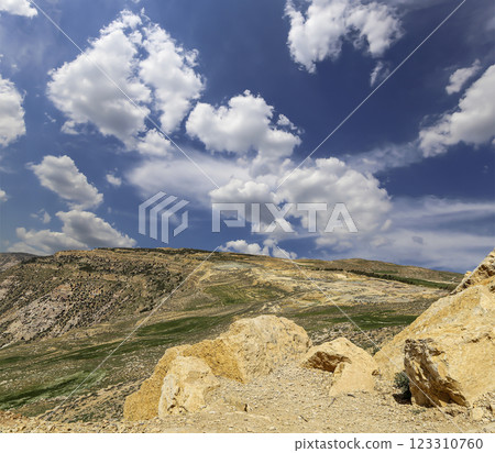 Typical mountain landscape, Jordan, Middle East (photography from a high point). Against the background of a beautiful sky with clouds Typical mountain landscape, Jordan, Middle East (photography from a high point). Against the background of a beautiful sky with clouds 123310760