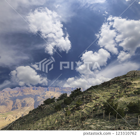 Typical mountain landscape, Jordan, Middle East (photography from a high point). Against the background of a beautiful sky with clouds Typical mountain landscape, Jordan, Middle East (photography from a high point). Against the background of a beautiful sky with clouds 123310762