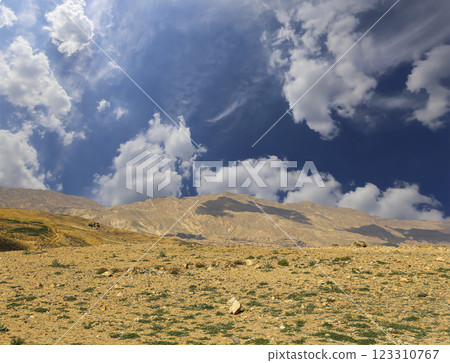 Typical mountain landscape, Jordan, Middle East (photography from a high point). Against the background of a beautiful sky with clouds Typical mountain landscape, Jordan, Middle East (photography from a high point). Against the background of a beautiful sky with clouds 123310767