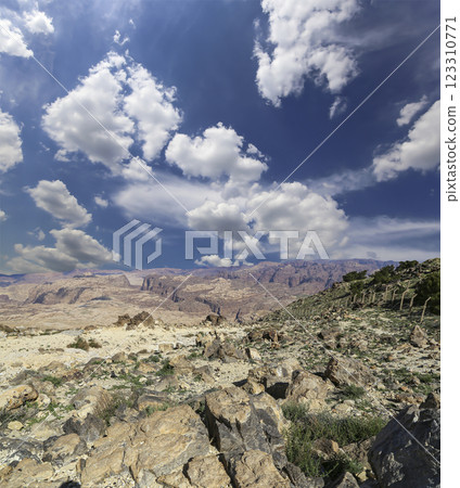Typical mountain landscape, Jordan, Middle East (photography from a high point). Against the background of a beautiful sky with clouds Typical mountain landscape, Jordan, Middle East (photography from a high point). Against the background of a beautiful sky with clouds 123310771