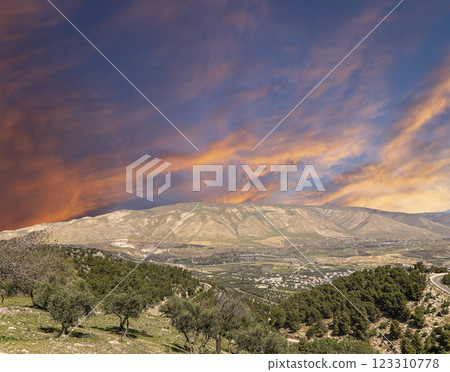 Typical mountain landscape, Jordan, Middle East (photography from a high point). Against the background of a beautiful sky with clouds Typical mountain landscape, Jordan, Middle East (photography from a high point). Against the background of a beautiful sky with clouds 123310778